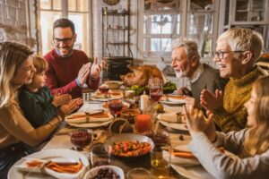 family-around-table-at-thanksgiving