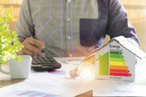 person-calculating-money-saved-with-home-efficiency